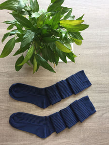 Over piles of stockings knit socks
