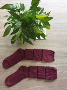 Over piles of stockings knit socks